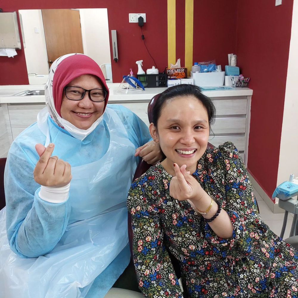 dentist with patient at Klinik Pergigian ADL, Petaling Jaya Dental Clinic